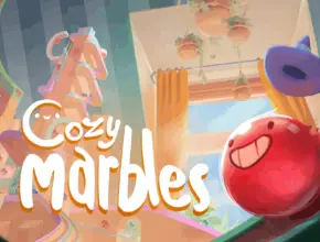 Colorful gameplay scene from Cozy Marbles showing rolling marbles and bright environment.