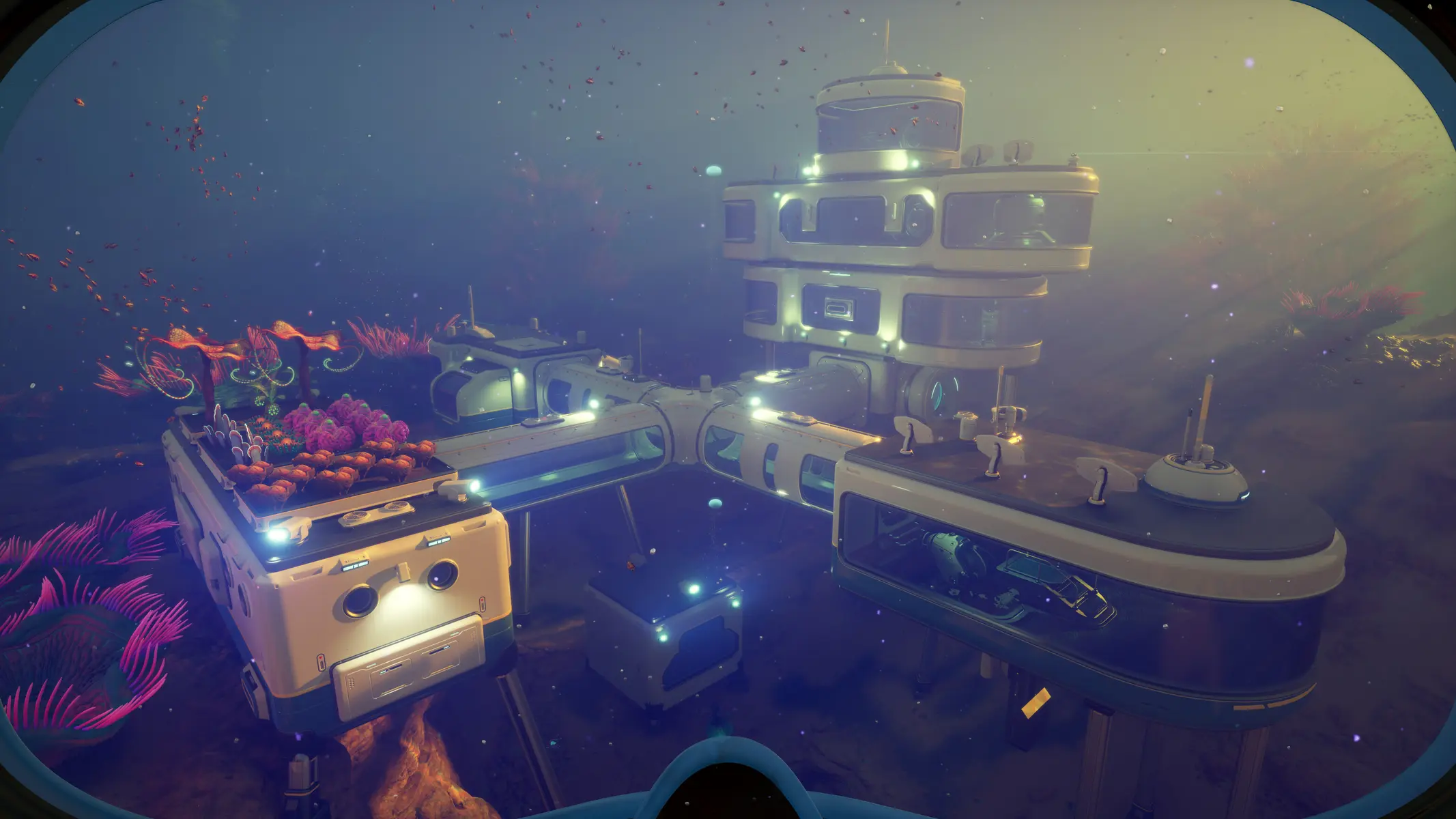 Een futuristische onderwaterbasis met witte modules en een plantenbak in de oceaan van Subnautica 2.